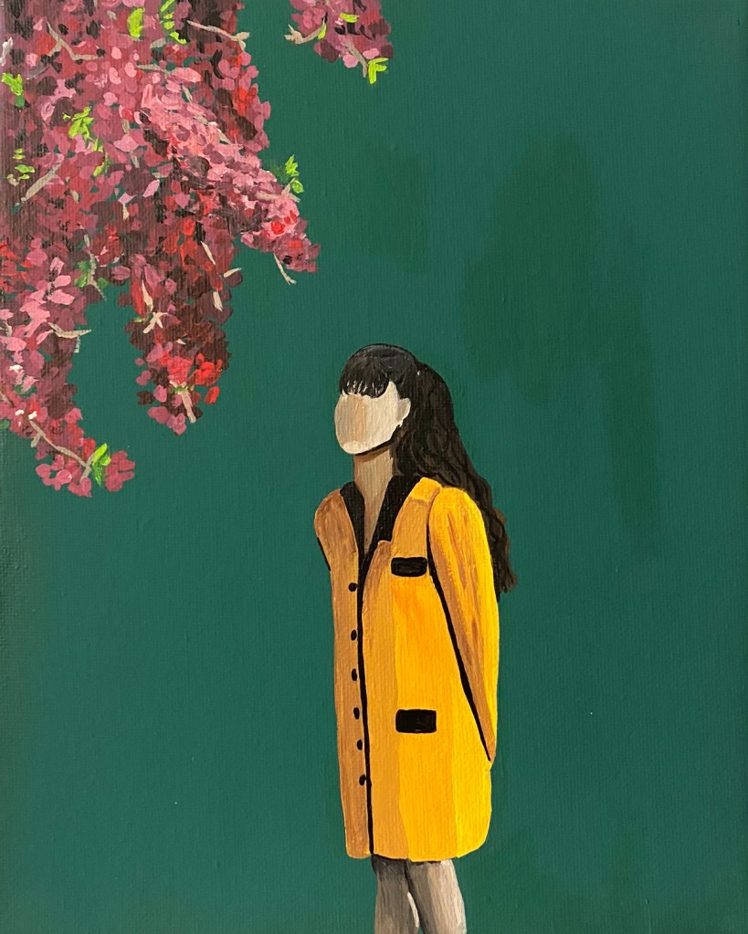 A faceless woman is centered wearing a yellow button-down dress with black accents. She has long black hair pulled back and bangs. Her face is angled toward the top left corner where there are branches of a pink, purple, and burgundy flowered tree. The background is a teal green.